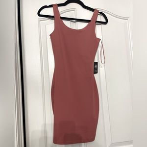 Brand new with tags express coral color bandage dress.